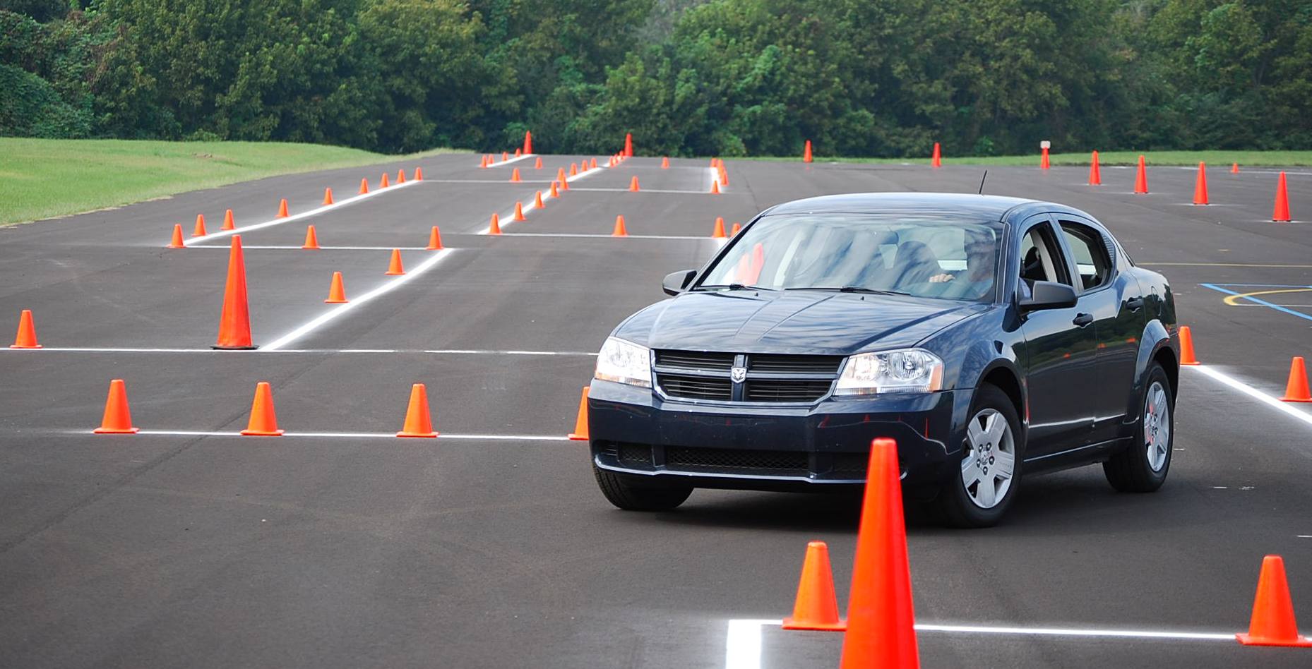 A car working through a coned manoeuvring course