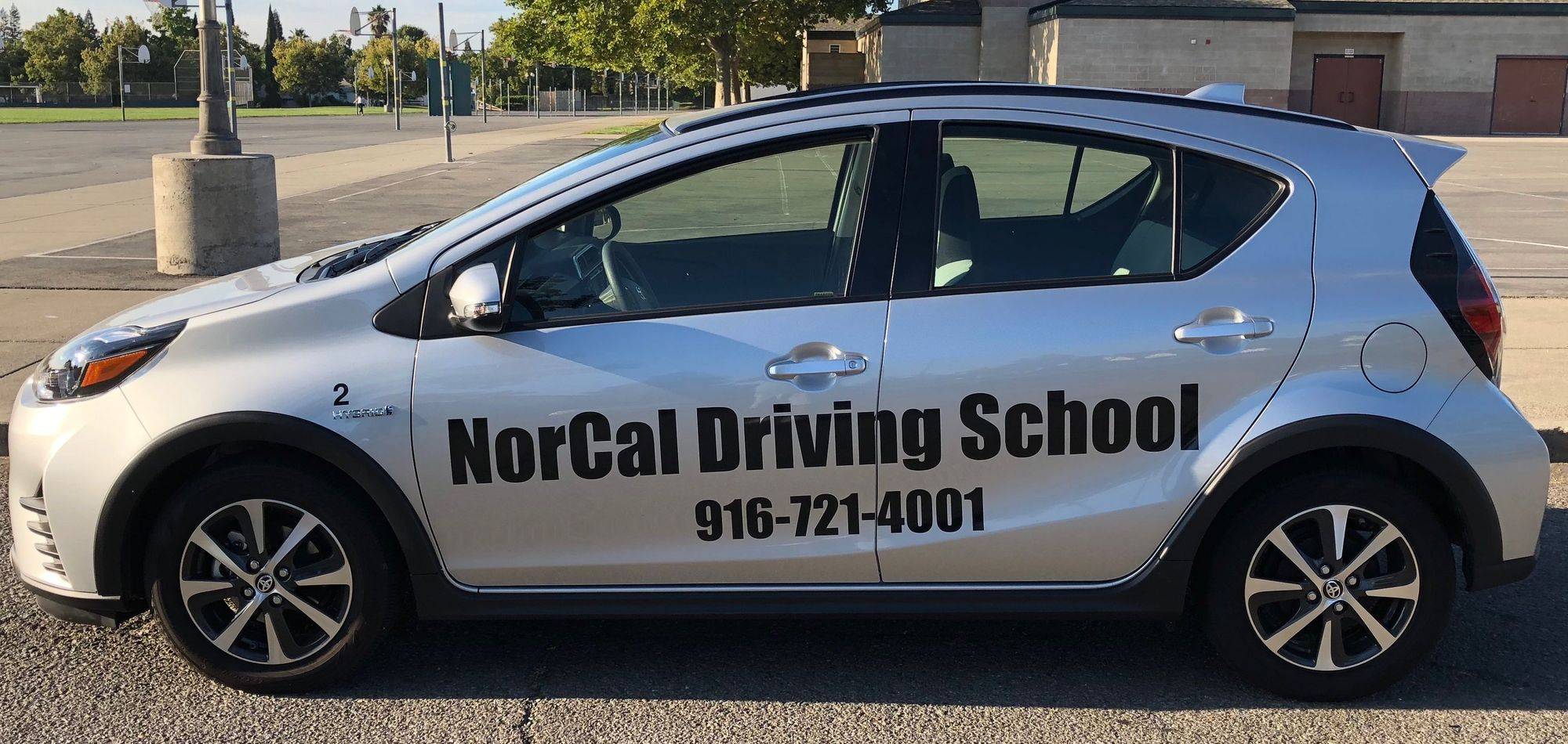 The NorCal Driving School Toyota Prius, signwritten with the school name and number