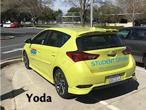 Yoda, the bright yellow Turlock Driving School hatchback with STUDENT DRIVER across the back