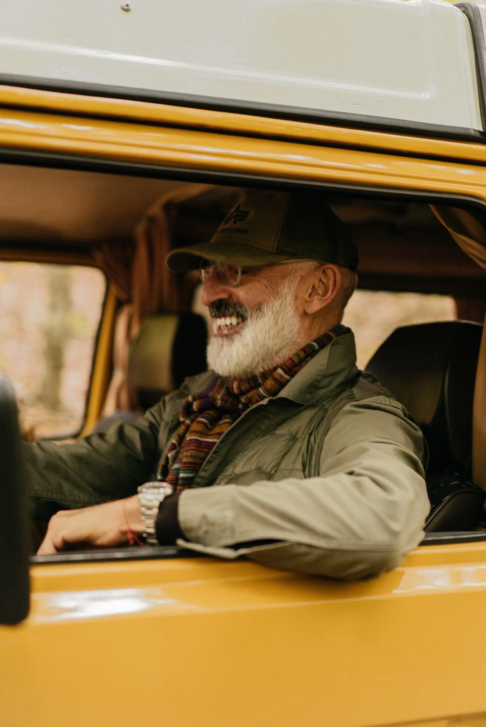 A mature learner smiling confidently from the driver’s seat